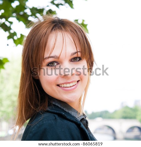 beautiful attractive young woman smiling while looking back
