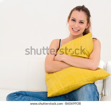 beautiful smile young woman with green pillow