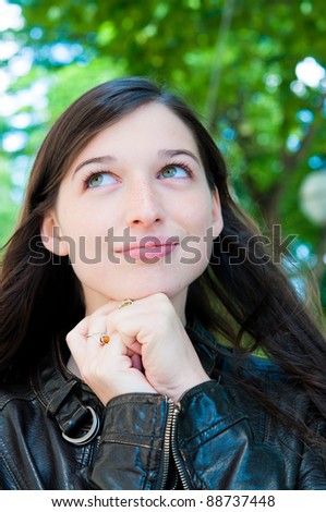 beautiful young attractive woman outdoors portrait of thinking woman