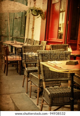 old-fashioned Cafe terrace with tables and chairs,paris France