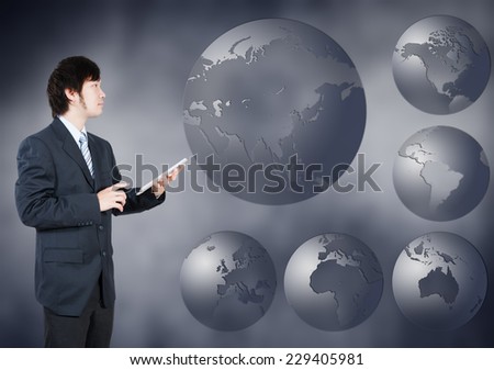 Asian Businessman choosing Asia continent, business concept of decision making