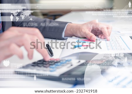 Business person using calculator against technology background