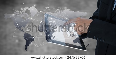 Businessman using tablet with digital visual object, business strategy concept