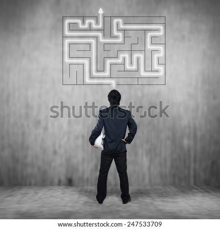 Businessman with maze, business concept of decision making