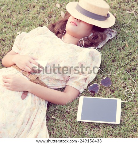 Vintage Girl sleep in park listen music via small talk