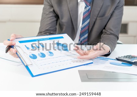 Businessman show analyzing report, business performance concept