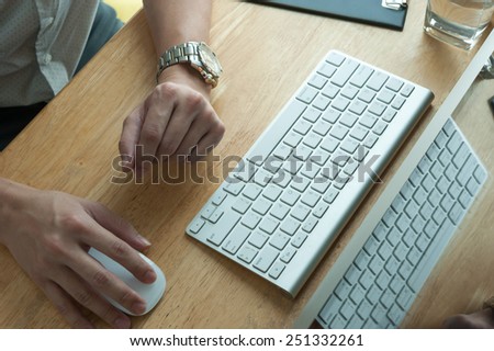 Man using desktop pc computer, mobile office concept