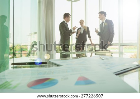 business partners use tablet discussing documents and ideas at meeting