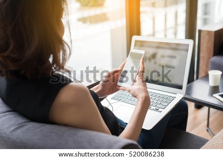Smart woman using smart phone and laptop, Social media life style of new generation for living, internet of things conceptual, world of smartphone, smartphone in everyday life
