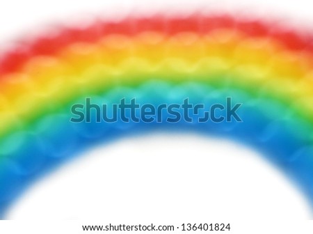 An abstract rainbow defocused with large circular bokeh elements
