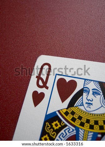 Close up of a queen of hearts card with shallow DOF