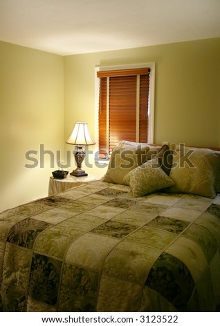 An inviting bed in a luxurious warm color palette