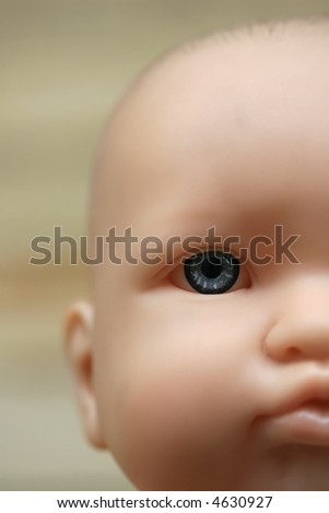 A close up of a baby doll face