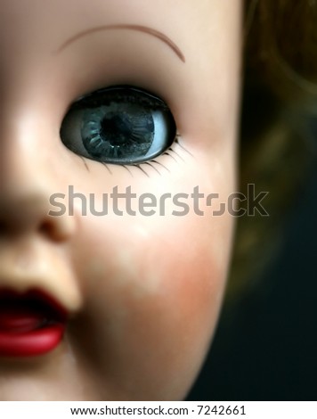 Close up a blue eyed doll with red lips