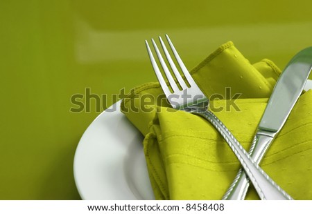 stock photo An elegant holiday table setting with fork knife and napkin