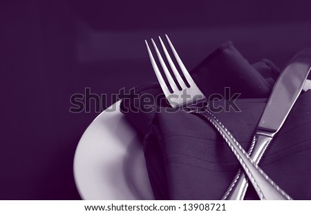 stock photo An elegant table setting in in blue purple duotone