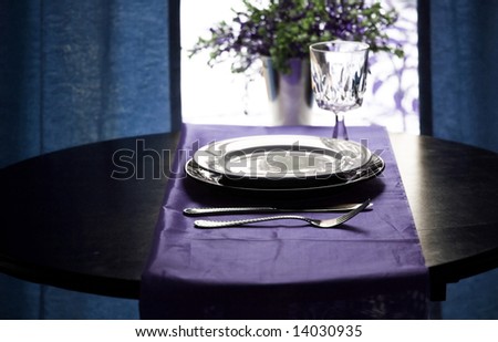 A fancy restaurant table setting in blue