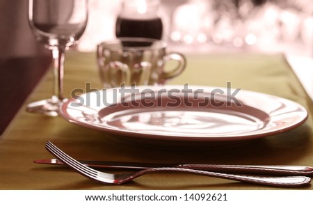 stock photo A fancy wedding table place setting in warm tones
