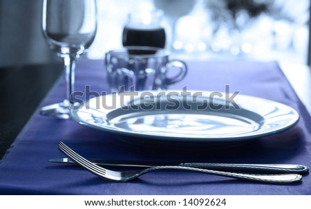 stock photo An elegant wedding table place setting in cool tones