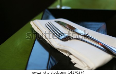 A close up of silverware on the dinner table