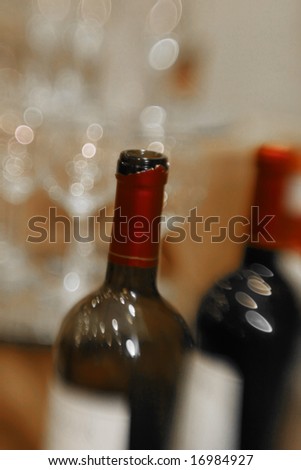 A reception party table with wine and wine glasses - motion blur, selective focus