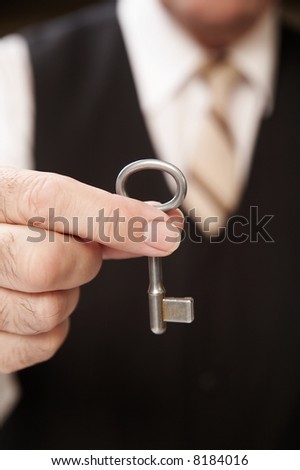 businessman with key of success