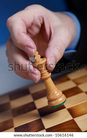 businessman\'s hand  with chess