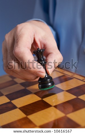 businessman\'s hand  with chess
