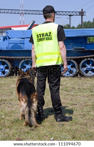 Photo of railway station security guard officer with a dog