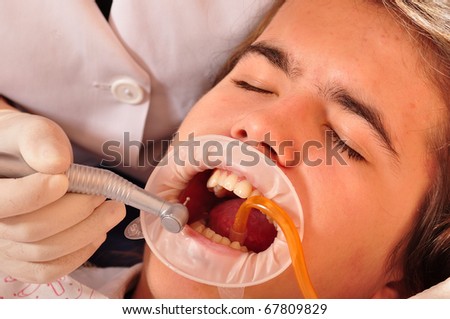 Photo of patient having his teeth healed.