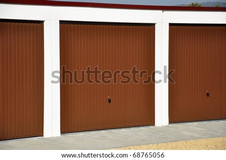 Photo of garages one close to another.