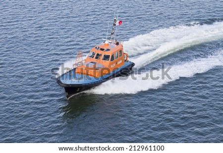 CAEN, FRANCE - 2nd Aug 2014: Pilot boat about to come along side ferry leaving Caen harbour France on Aug 02, 2014.
