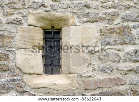 Old castle window with iron bars