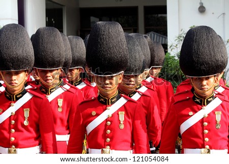 BANGKOK - DECEMBER 5 : A row of Thai royal guard military march during the king\'s birthday parade on Dec 5 ,2012 in Bangkok ,Thailand