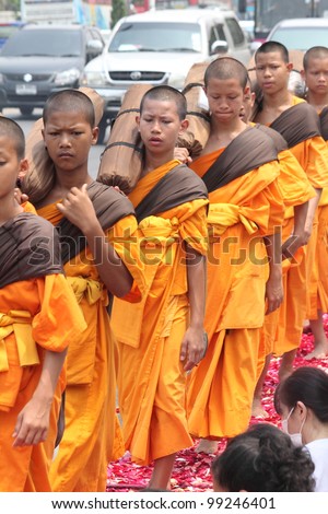 BANGKOK,THAILAND-APRIL 3: Monks walking for praying to king of Thailand on April 3, 2012 in  Bangkok,Thailand . 90% of the Thai population is Buddhist