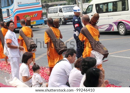 BANGKOK,THAILAND-APRIL 3: Monks walking for praying to king of Thailand on April 3, 2012 in  Bangkok,Thailand . 90% of the Thai  population is Buddhist