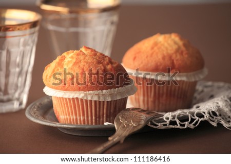 Freshly baked assorted muffins on a cake stand