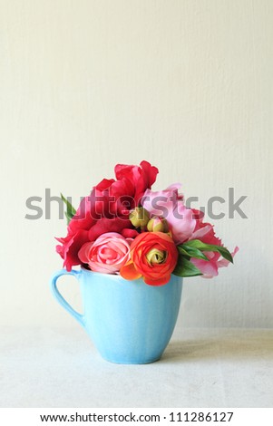 Flower bouquet in a blue mug