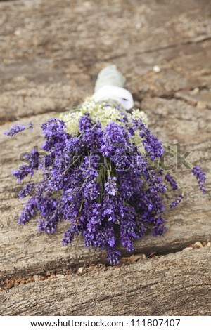 Bunch of lavender flowers for wedding on an old wood table