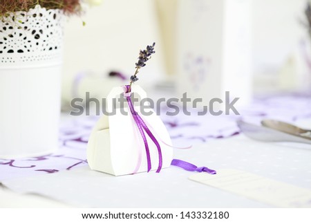 Goody bag with lavender at wedding reception. Shallow focus.