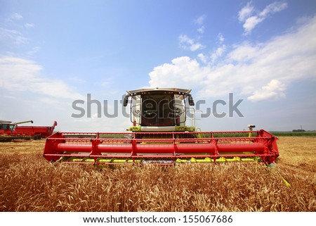 New combine harvester working in a wheat field