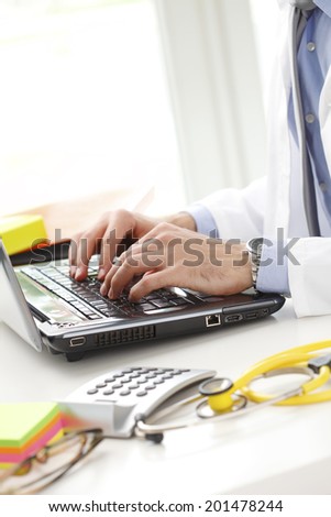 Male doctor working at private clinic.