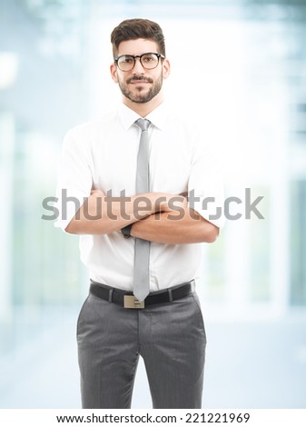 Portrait of young broker standing at office. Business people.