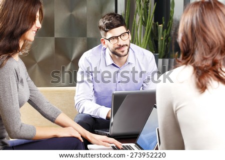 Image of young businesswoman sitting at job interview. Business people sitting at office and discussing.