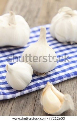Fresh garlics on the garden table