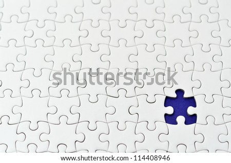 Plain white jigsaw puzzle, on Navy background.
