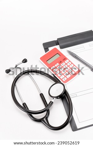 Stethoscope of medical equipment, and medical records, Calculator.
