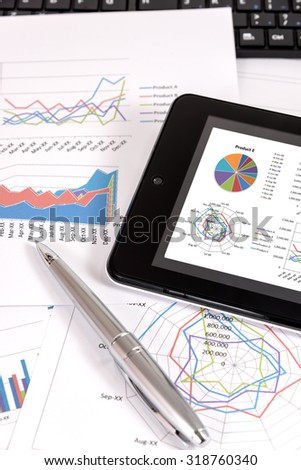 Business performance analysis. Business Graphs with tablet, pen.