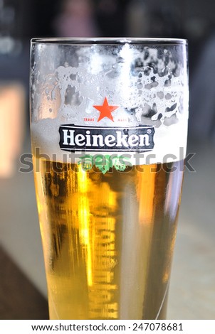 GENEMUIDEN, THE NETHERLANDS, 24 JANUARY 2015 - Beer glass with beer and the Heineken logo and word brand.