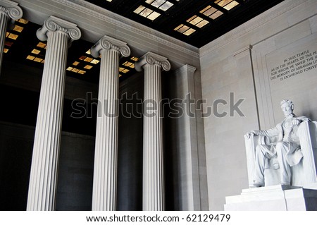 Inside the Lincoln Memorial, showing great columns and the statue of Abraham Lincoln, in Washington DC.